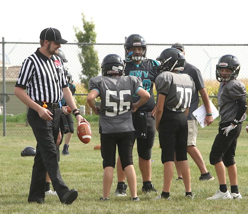 David Sciranko walks the football to the line of scrimmage, officiating a Nodaway Valley/O-M vs. Southwest Valley junior high game this fall.