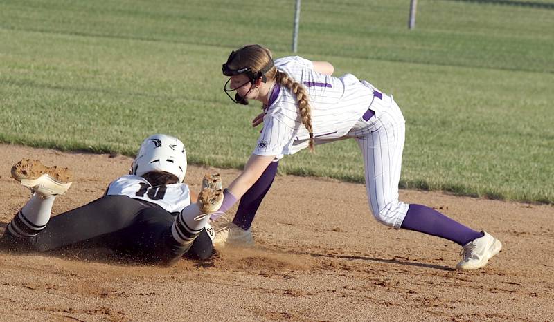 Nodaway Valley/OM's Destiny Fry tags Wayne's Brystal Peck out at second base in a recent softball game in Greenfield.