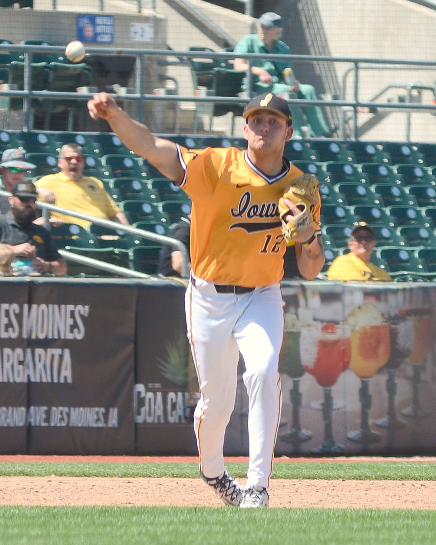 Jaixen Frost makes a warm-up throw to first base before the start of the eighth inning Sunday at Principal Park.