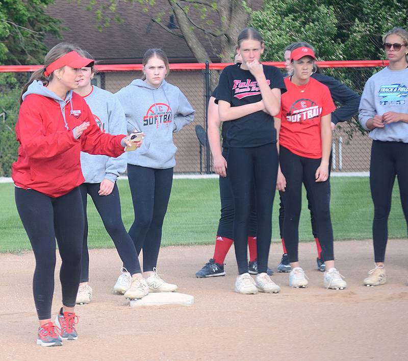 Creston coach Gracie Hagle demonstrates a secondary lead technique during baserunning drills last week. The Panthers open the season May 18 at home against Clarke.
