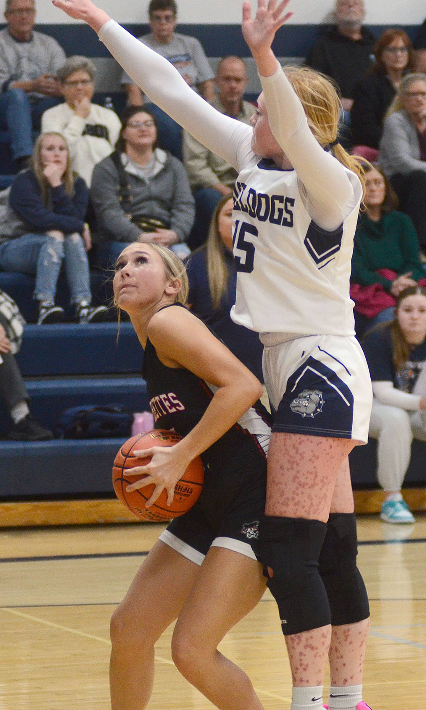 Mount Ayr's Tatum Friedrich is fouled by Paisley Sleep of Bedford on a move to the basket Thursday.