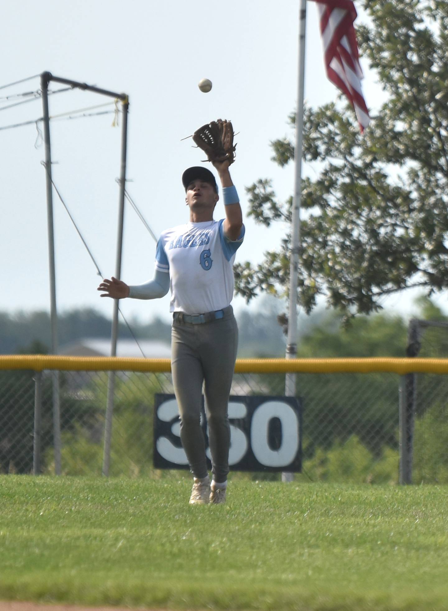Centerfielder Rason Grail catches a fly ball against Mormon Trail. On offense, he had two of the Eagles' 11 runs.