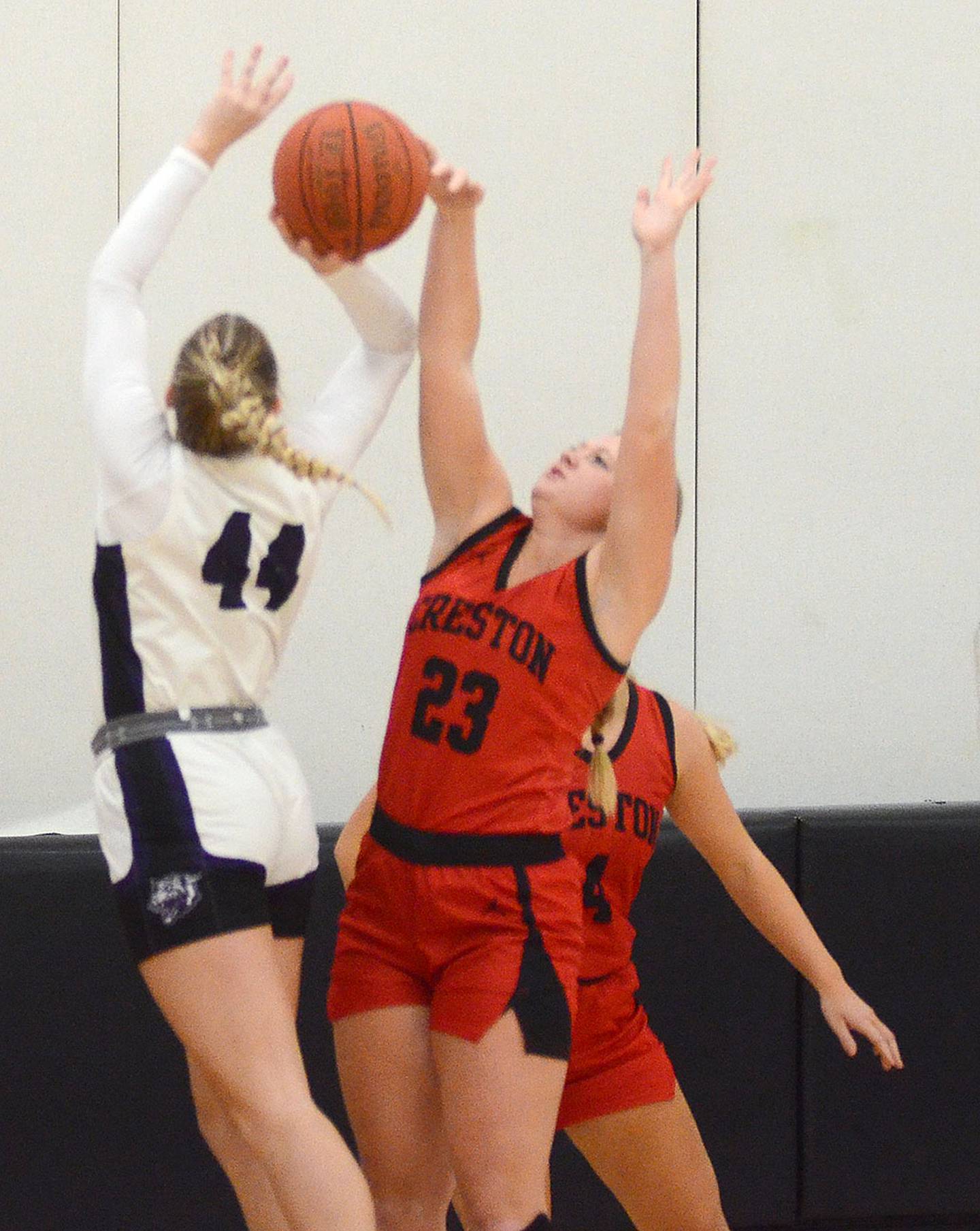Brynn Tussey blocks a shot by West Central Valley's Macy Long during Monday's game.