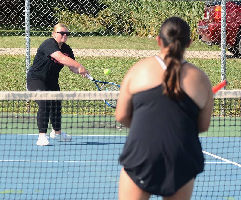 Creston's Brooke Huck returns a shot during the No. 3 doubles match Tuesday. Huck and Savannah Jaques won the match, 8-6.