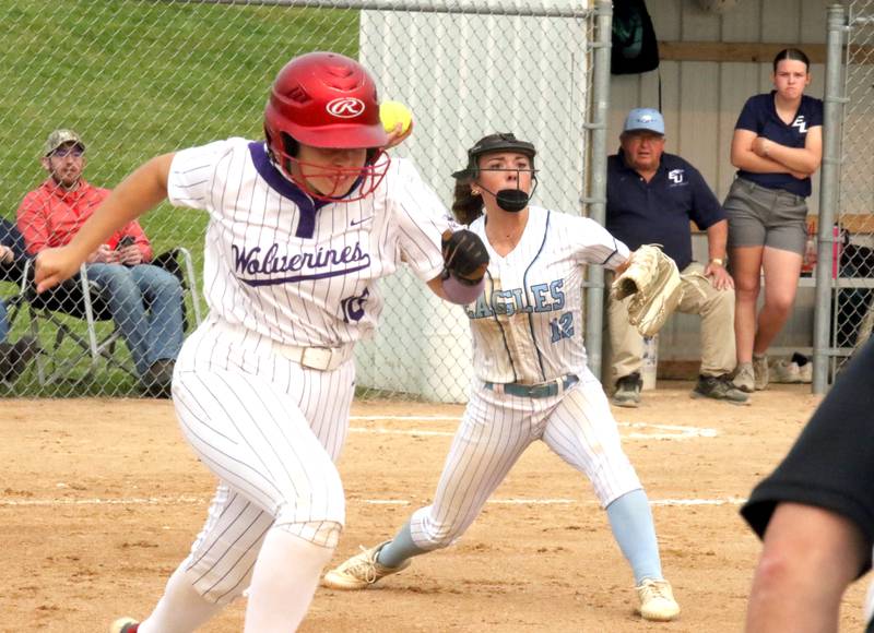 NV/OM senior Carter Osborne tries to beat the throw of East Union catcher Tristin Lear during a softball game in Greenfield May 30.