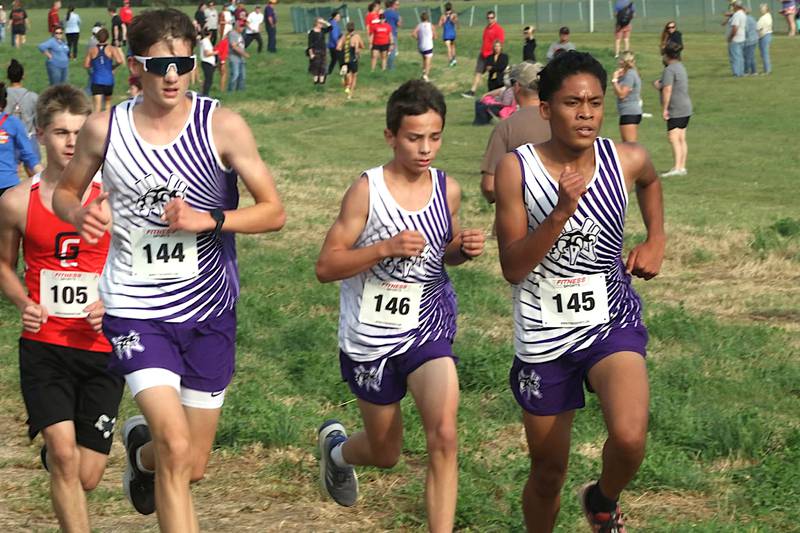 From left, Paul Kading, Josh Nelson and Cherubim Mercado run in the Wildcat Invite hosted by West Central Valley recently in Redfield.