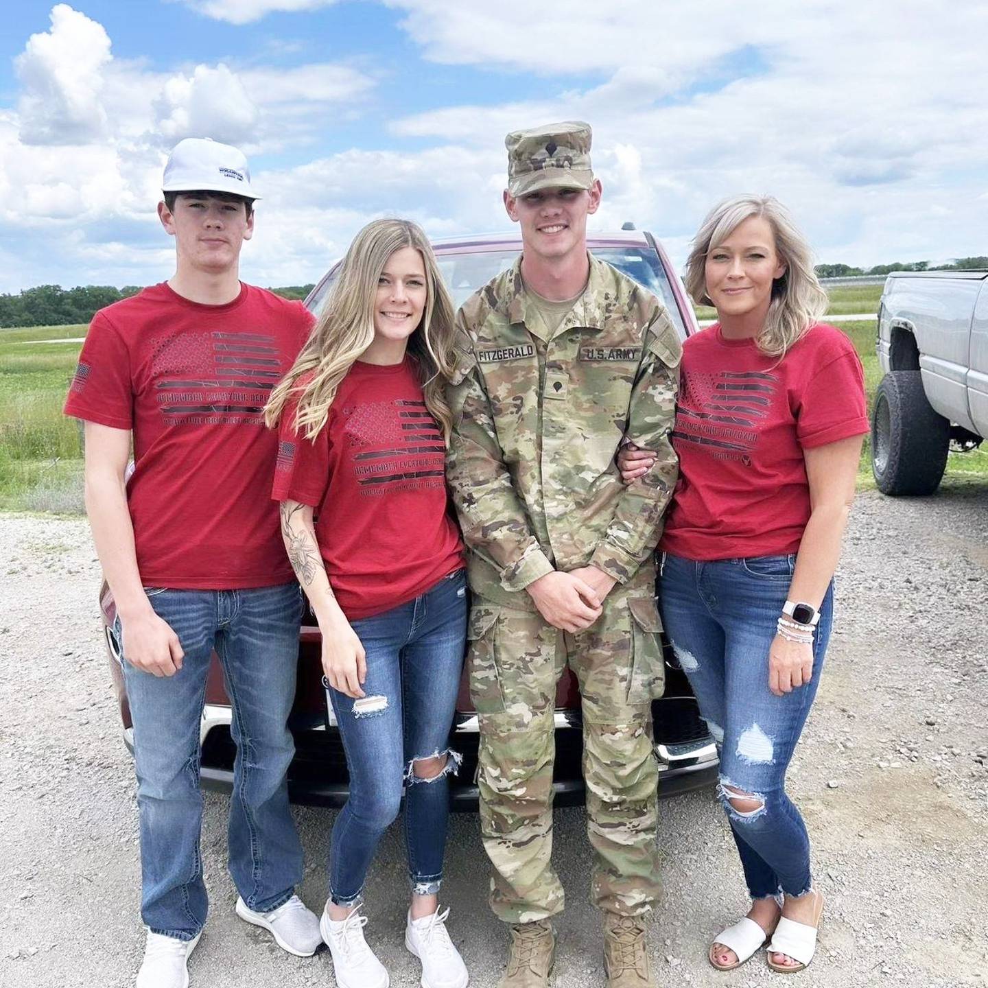 Conner Fitzgerald of Lenox stands with siblings Levi and Jaycee and mom Tamara. Fitzgerald is a vehicle mechanic based out of Red Oak.