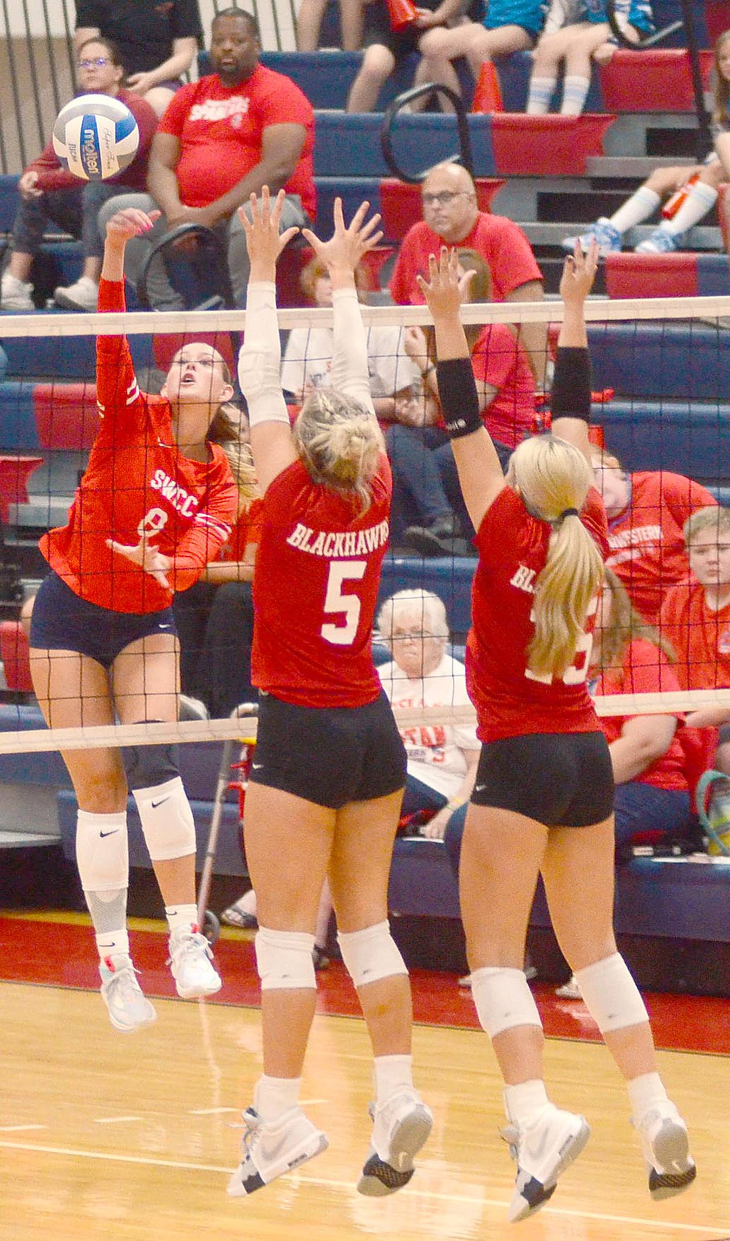 Southwestern's Sophie Lyle (8) attacks the Southeastern court during Wednesday's match.