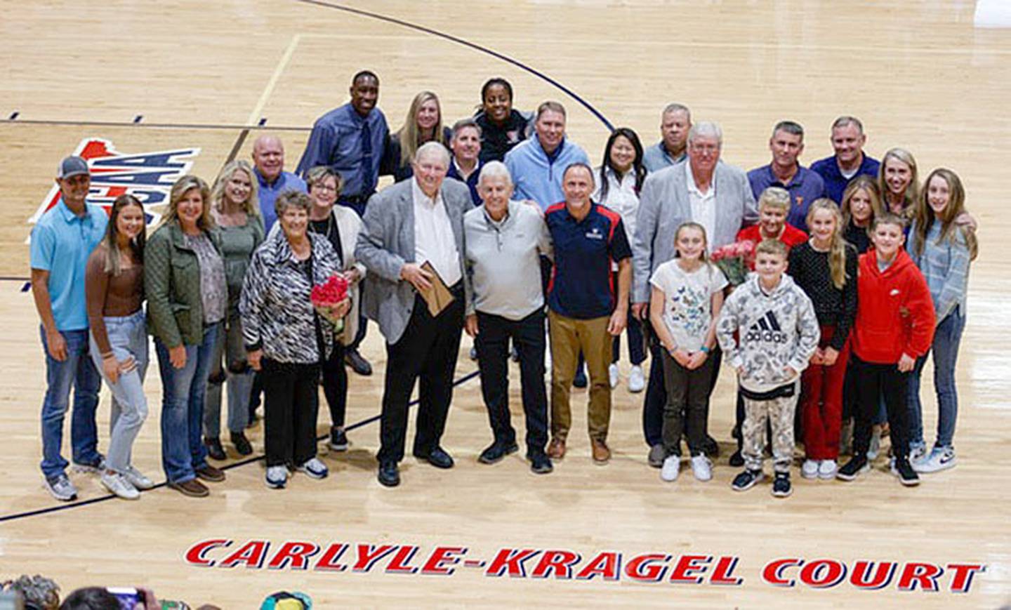 Dave Kragel (right side with family and grandchildren) and Bill Carlyle were joined by family at the ceremony naming the Walters State court.