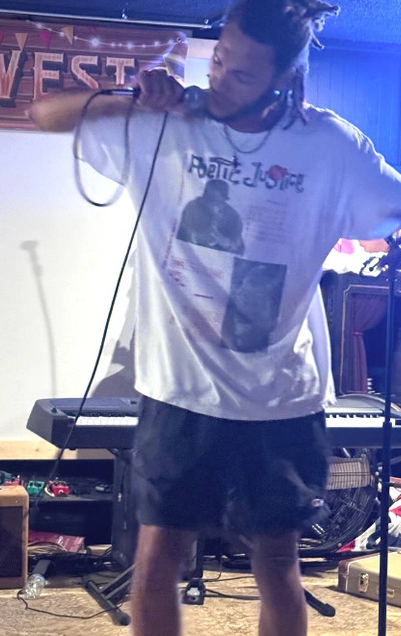 Khalil Sherrod performs music as Kingill at an event in Des Moines earlier this month.