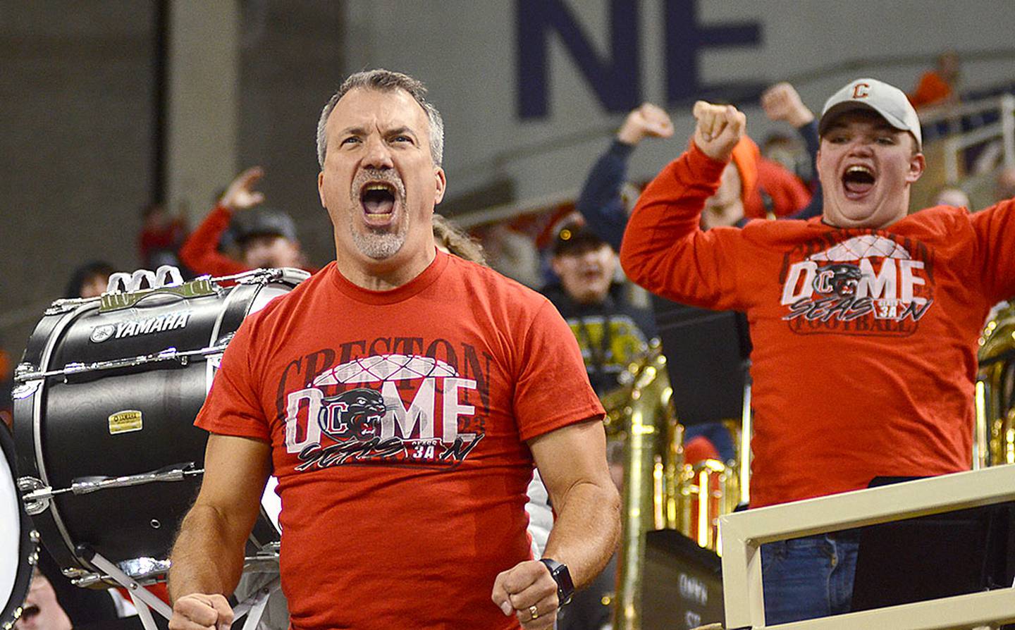 Creston band director Mike Peters shows his emotion during a big play by Creston in Saturdays semifinal game in the UNI-Dome.