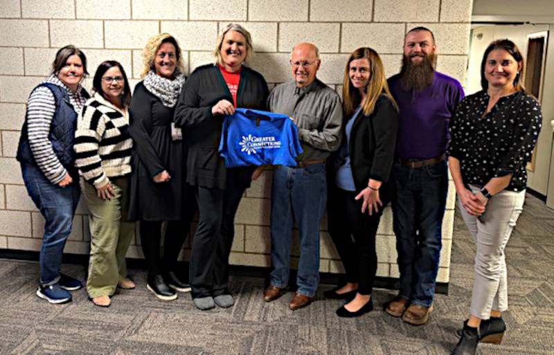 Kristie Nixon, Susan McNichols, Callie Anderson, Melissa Zellmer, Skip Kenyon, Stephanie Haffner, Joel Lamb and Amy Rieck announce the Mary Ann Kenyon Legacy Fund to assist with childcare costs.