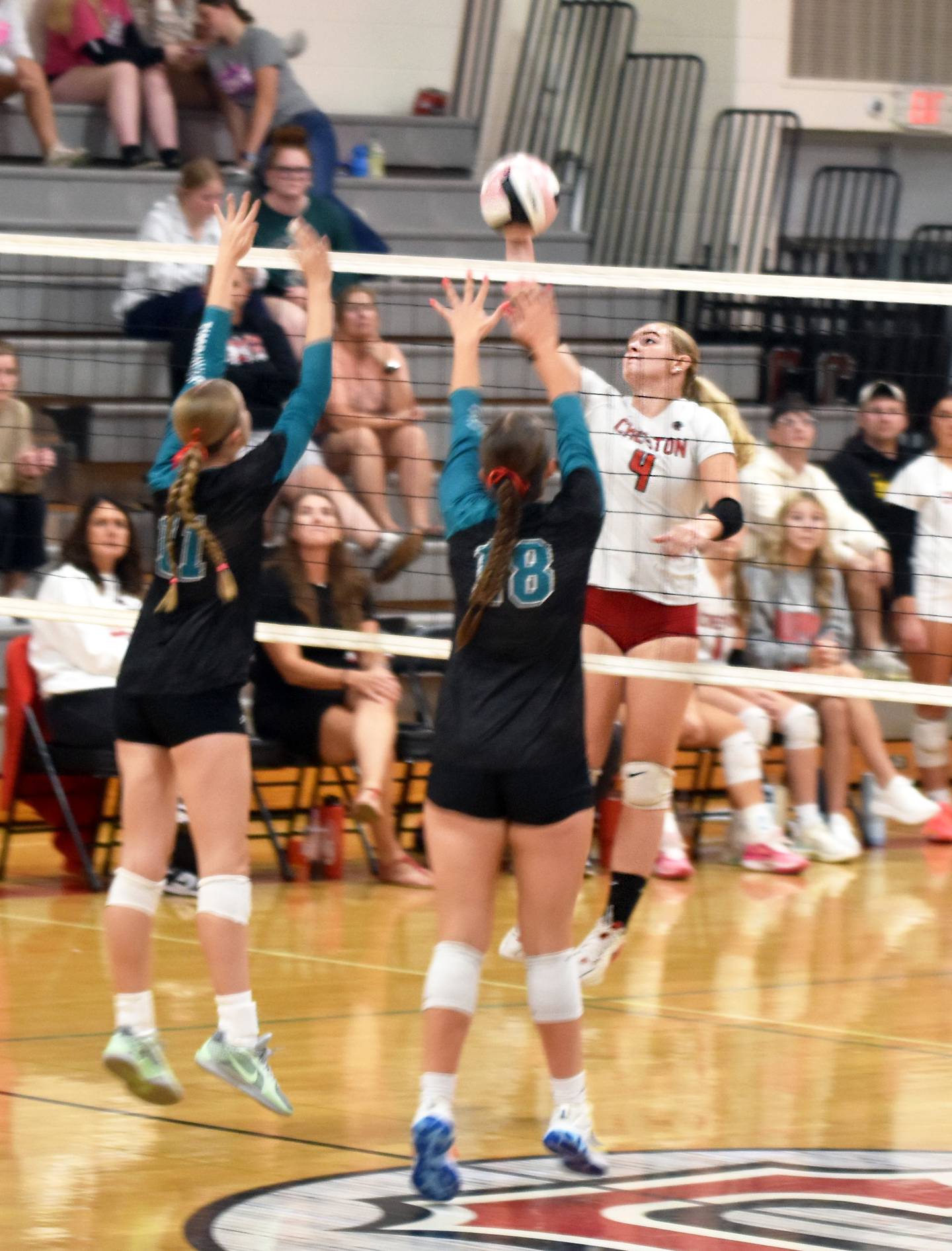 Creston senior Ella Turner puts a ball up over Southwest Valley defenders Mailee Templeton and Mackenzie Fast Tuesday in a 3-1 win over the Timberwolves.