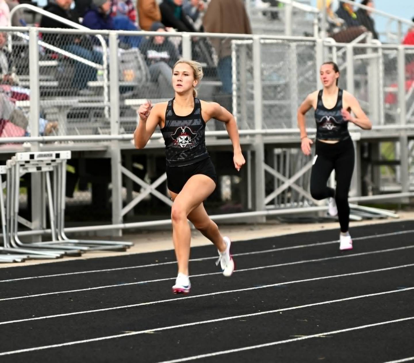 Tatum Friedrich of Mount Ayr races down the home stretch to a second-place finish in the 400m dash. She was also on the school-record breaking 4x400 relay.