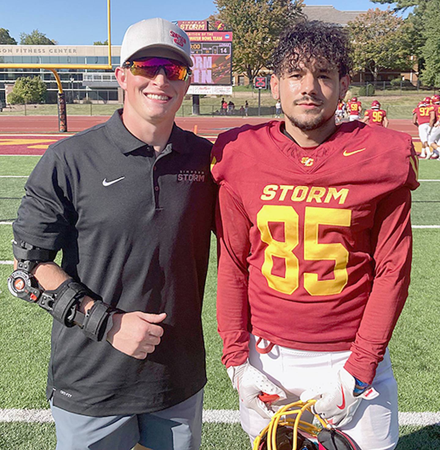 Former Simpson running back and current student coach Briley Hayes (left) and receiver/special teams player Kayleb Howard after a recent 66-14 home victory over Loras College. Hayes and Howard are former Creston teammates.
