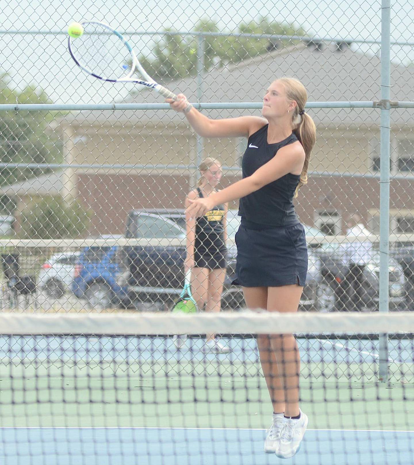 Creston's Marlee Stalker reaches to return a forehand shot during her 8-6 win at No. 3 singles against Atlantic.