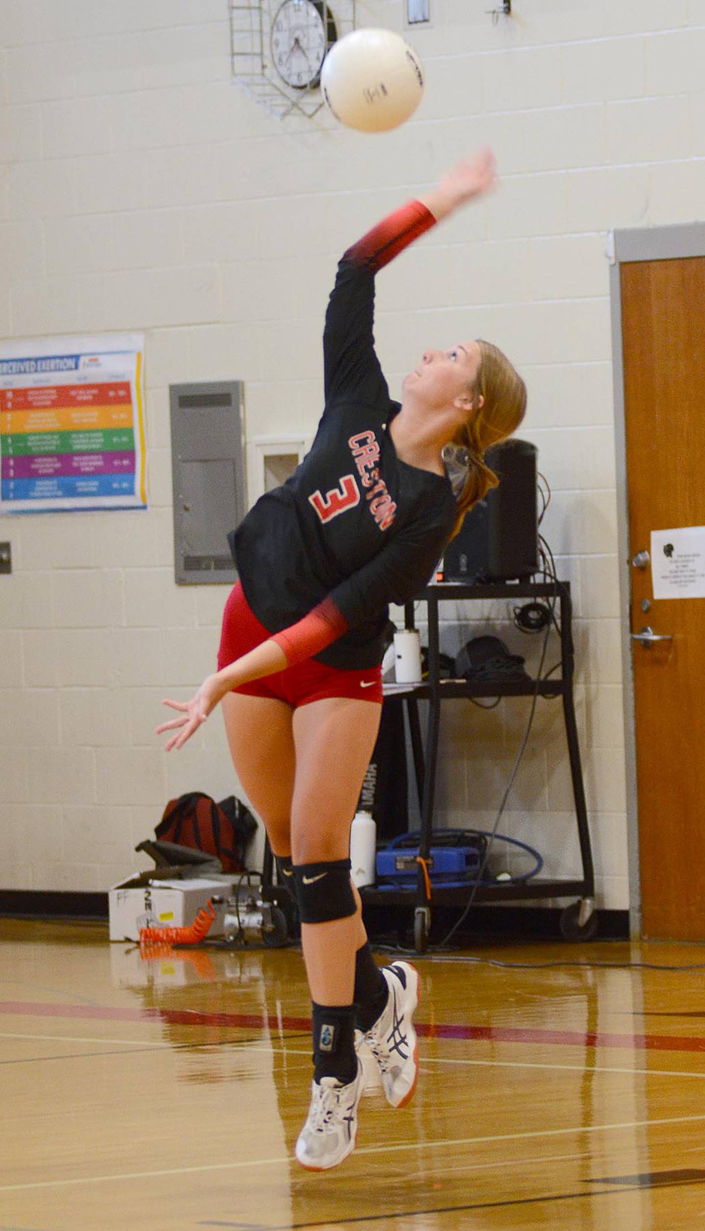 Kolbey Bailey of Creston connects on a serve against Lewis Central Tuesday night. Bailey had five digs in the 3-0 loss to the Titans.