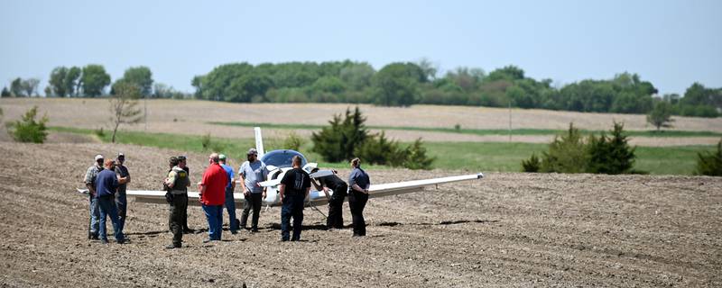 Union County first responders assess the scene of a downed plane Monday morning in a field south of Creston near Iris Avenue. The student pilot out of Des Moines made a successful emergency landing after engine failure. There were no injuries.
