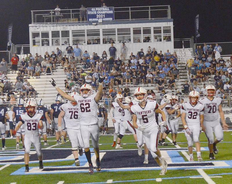 Creston offensive lineman Brayden Schoon (62) raises his arms in celebration as time expired in the Panthers' 22-20 victory at Lewis Central. Other teammates shown include Brandon Briley (83), Gunner Martwick (76), Josh Schaefer (5), Austin Evans (32) and Quinten Fuller (70). It was Creston's first win over Lewis Central since 2011.