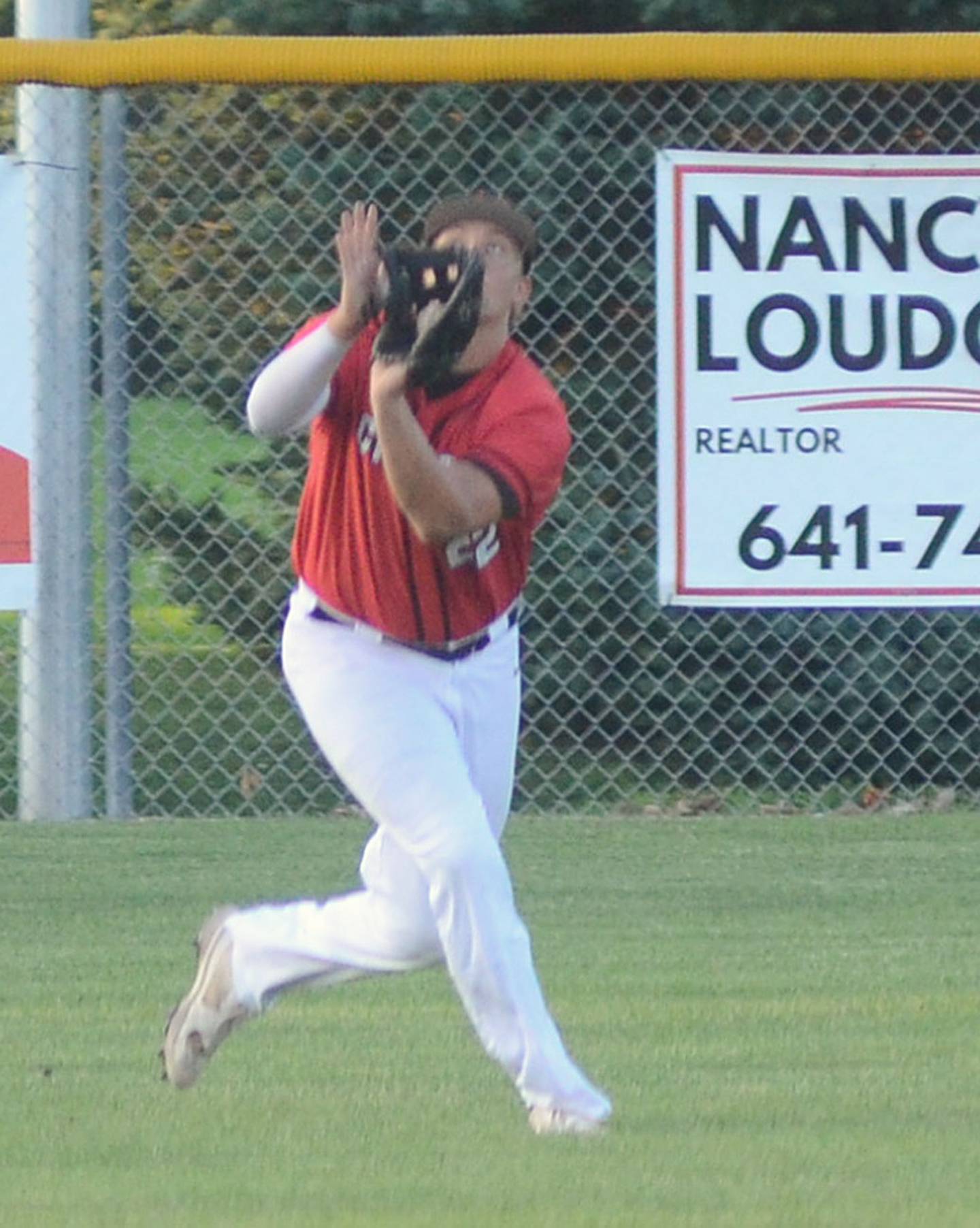 Creston left fielder Brayden Schoon tracks down a flyball during Friday's 5-2 home win over Clarinda.