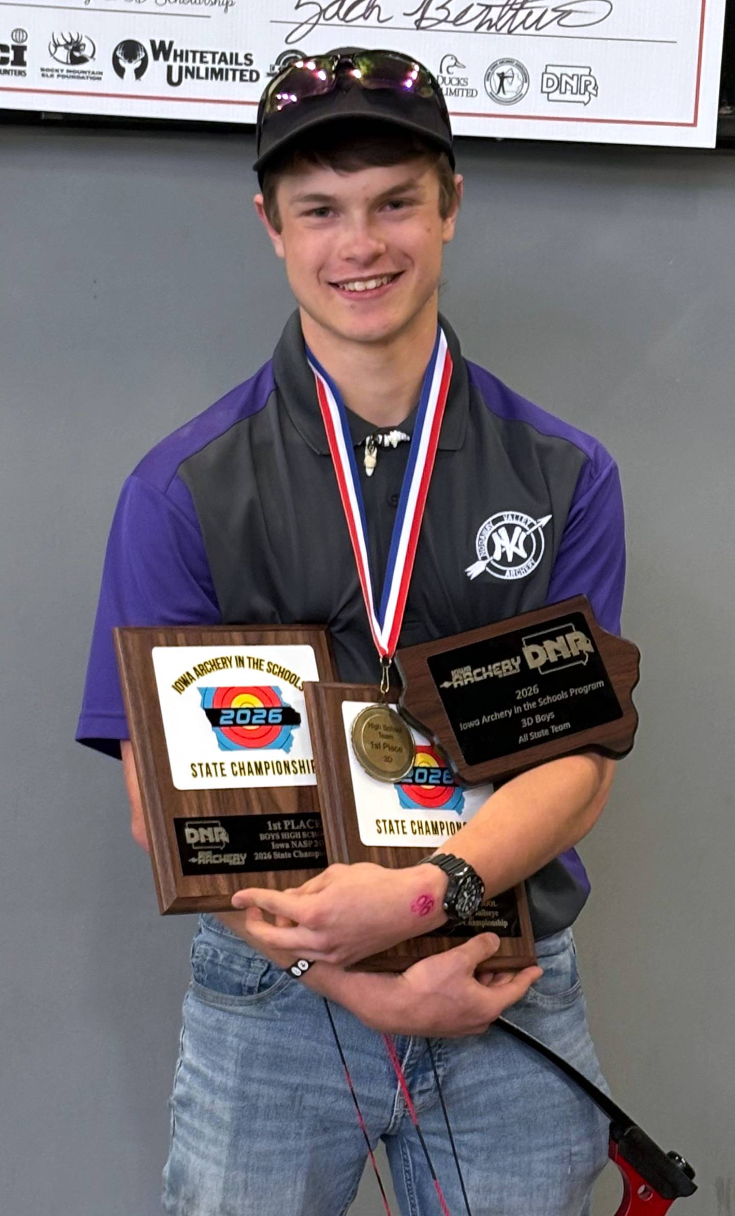 NV junior Collin Akers with his winnings at state archery.