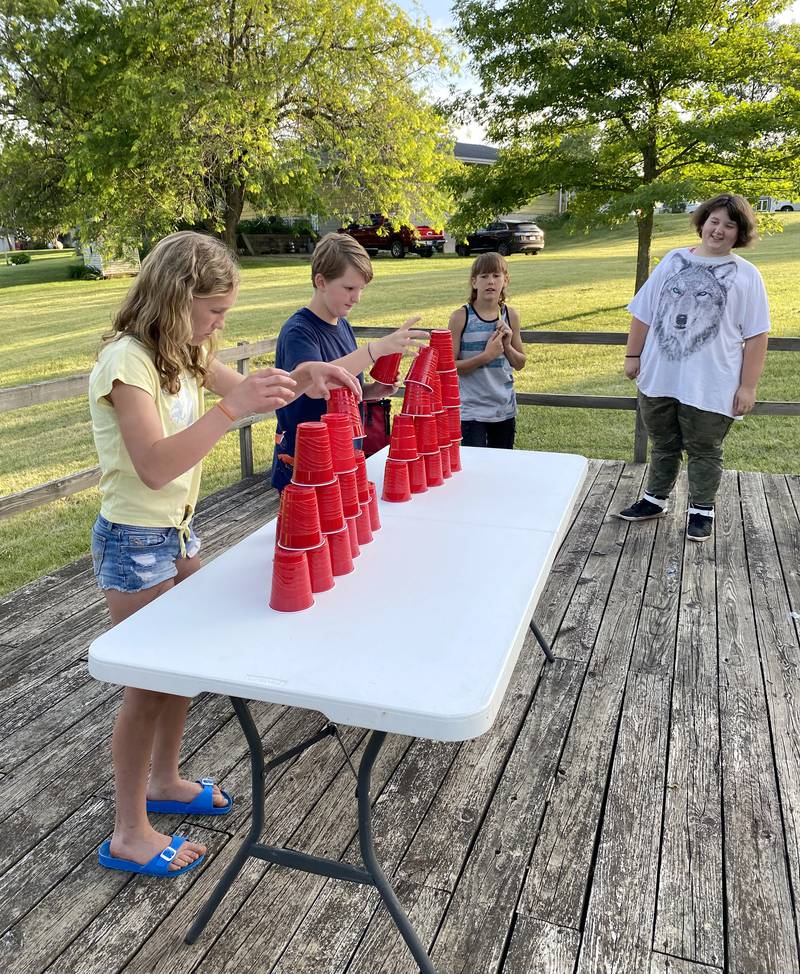 Area youth participate in a cup game during a past Bridgewater Roundup Day event.
