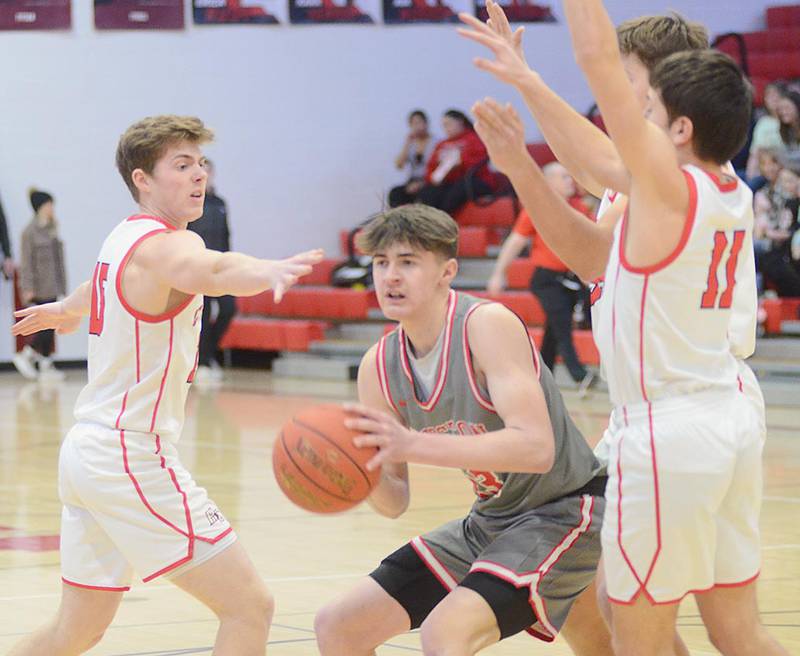 Creston's Jake Hoyt looks for an open teammate while surrounded by Harlan defenders Monday night. Hoyt led the Panthers with 21 points and 12 rebounds in the 56-51 overtime win.