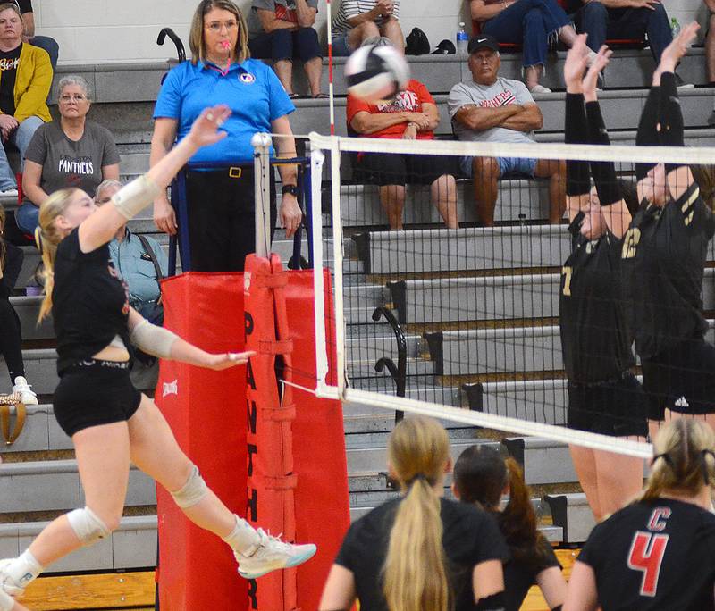 Creston's Jaycee Hanson (left) attacks the blocking attempt of Glenwood's Kayla Chriistian (7) and Addie Madison (12). Hanson led Creston with 20 kills and 23 digs.