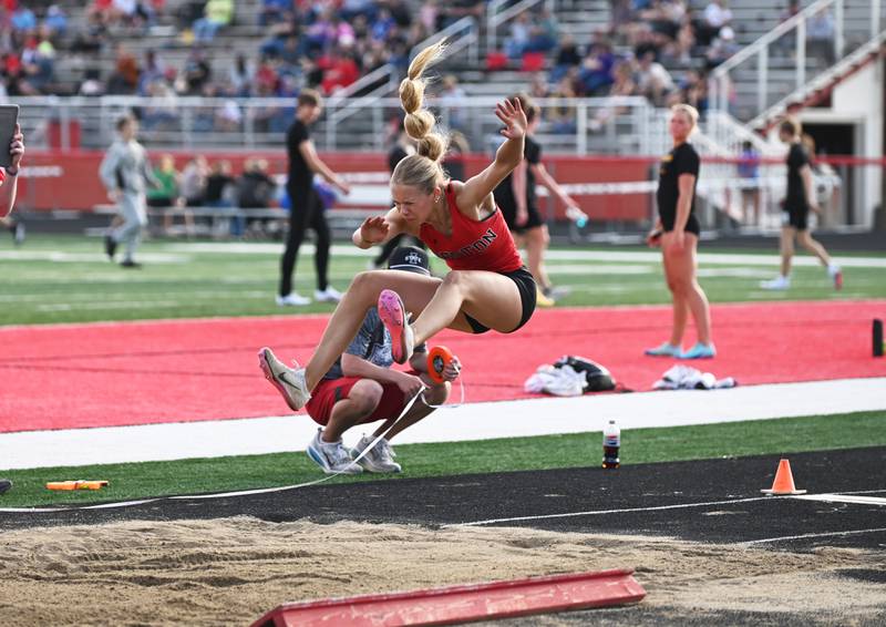 Cora Smith makes her final leap in the long jump Monday where she placed second.