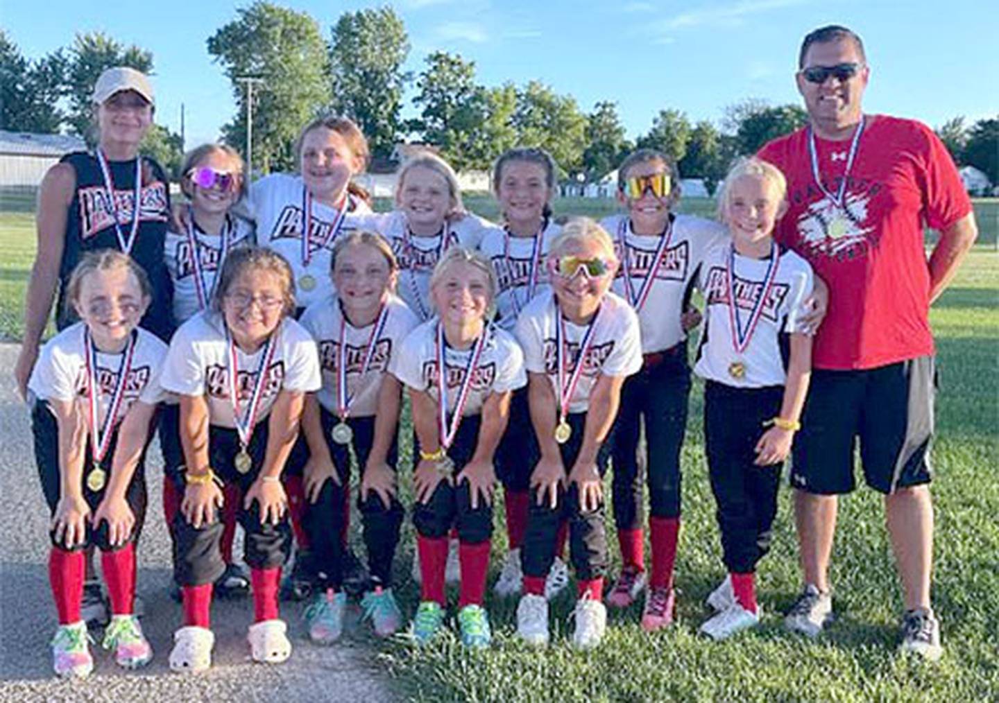 Jeff Veitz (back row, right) and Andrea Galanakis coached a Creston youth travel softball team last summer.