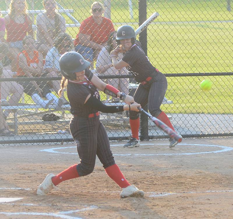 Creston's Evy Marlin drives a ball into left field during Thursday's second game against Red Oak. Marlin hit two home runs in the 18-1 victory in game one.