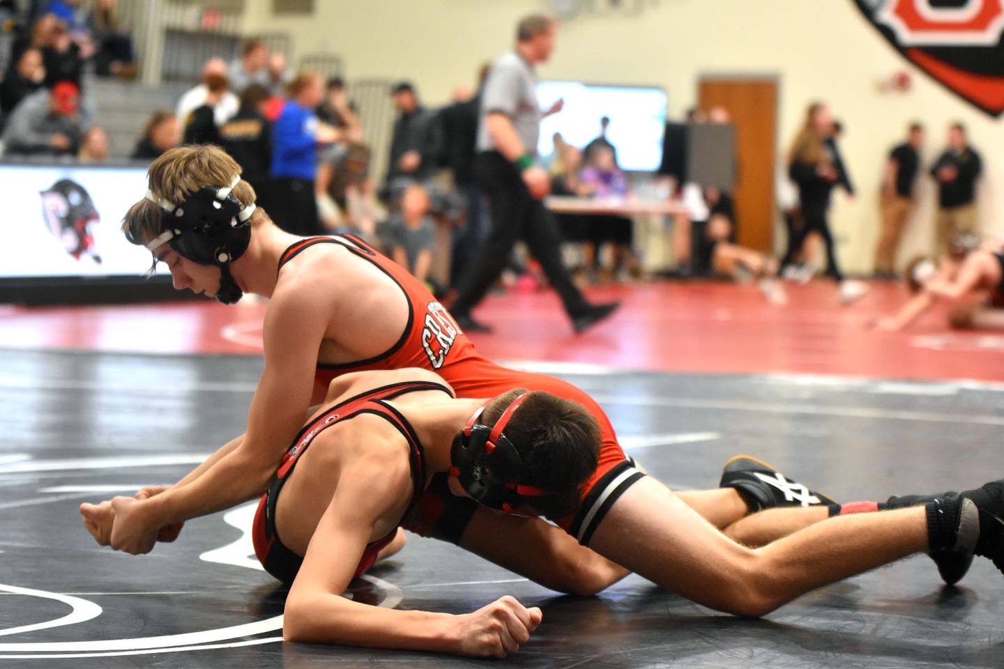 Kylen Parsons of Creston works an arm bar on Nathan Sandquist of Harlan, winning the bout to move on to the third-place match. Parsons won the match, taking third at 106.