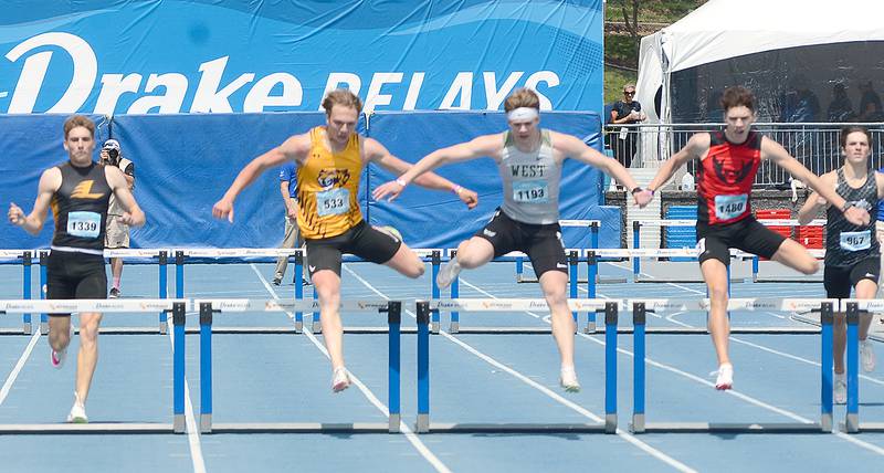 The leaders in the boys 400 meter hurdles at the Drake Relays Saturday clear the final hurdle. Shown from left are Gabe Funk of Lenox (fourth place), Tristan Rheingans of Central DeWitt (third), Aidan Jacobsen of Iowa City West (first) and Ryce Reynolds of Mount Ayr (second). Reynolds and Funk both improved their school records to 52.09 and 52.76, respectively.