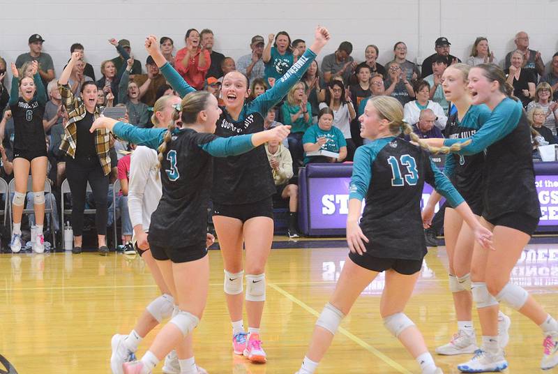 Southwest Valley players celebrate an ace serve by Morgan Shuler (left) during Monday's 3-0 regional semifinal win. Shuler had 35 assists as the team's primary setter.