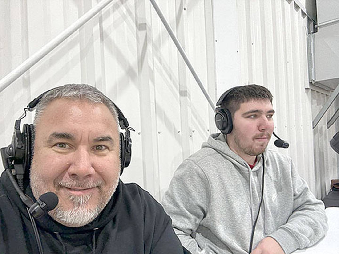 Kristopher "Kritter" Hayes (left) and son Reece Hayes are shown broadcasting a game for RadioKeokuk during Reece's winter break from Southwestern Community College.