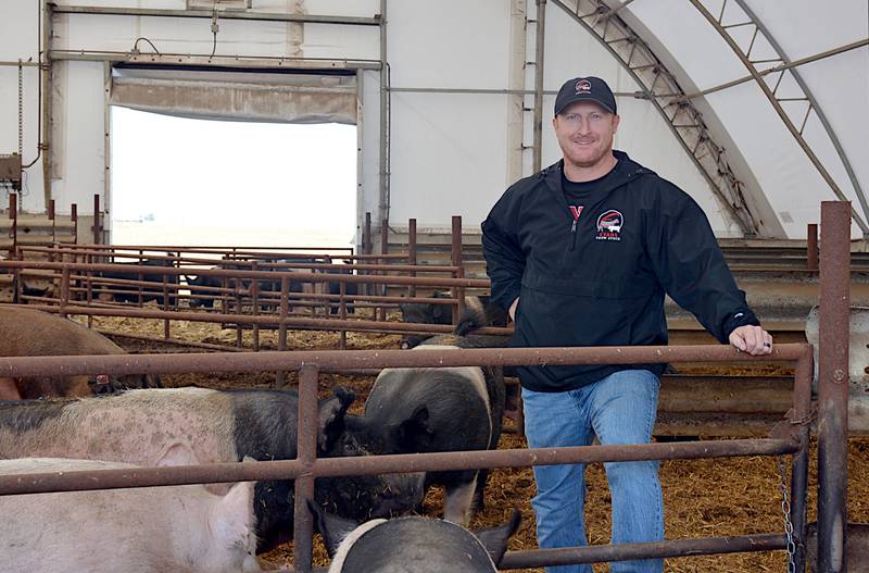 Kalab Evans of Orient with his show sows for Evans Show Stock, one of his two pork industry-based businesses. Evans grew up south of Lenox on a 700-head farrow-to-finish farm that is still in operation today.