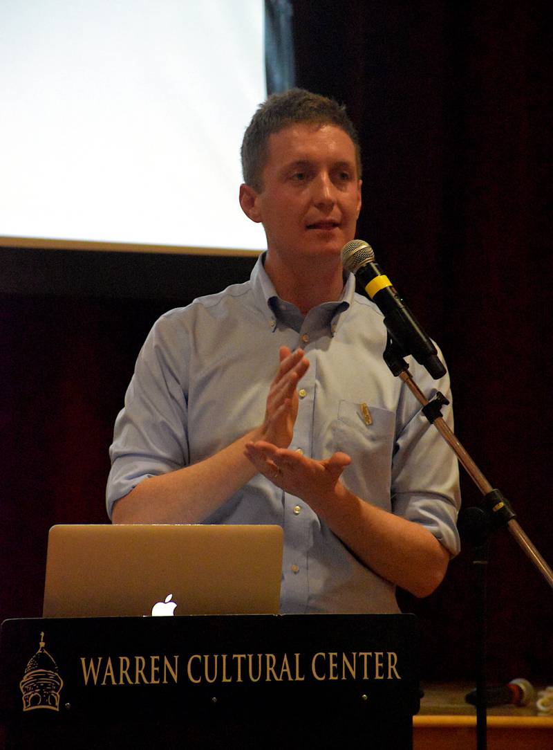 Author Austin Frerick explains his book about food-related corporations during his speech in Greenfield.