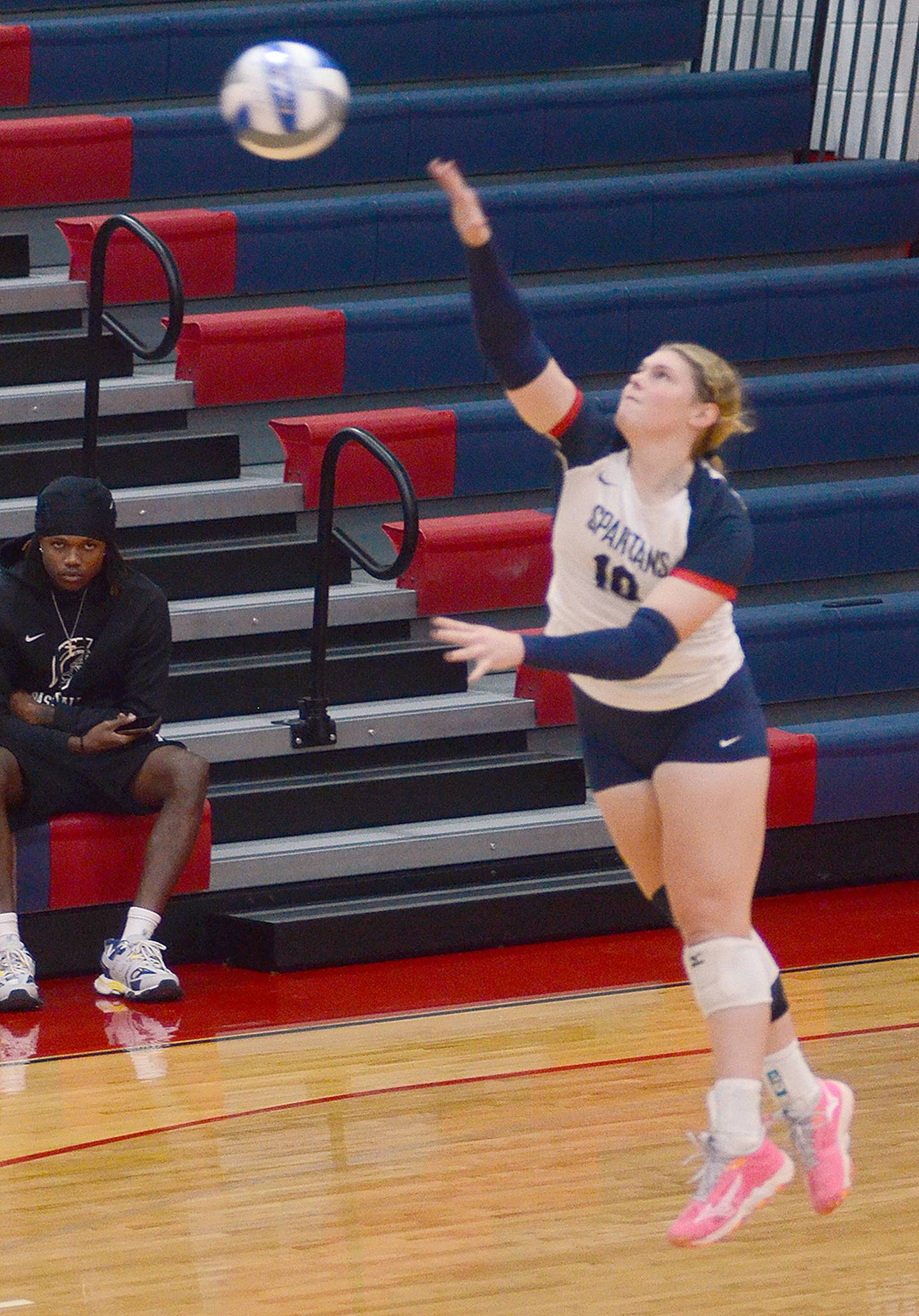 Maddie Richter serves during Wednesday's match. The freshman from Anita finished with five kills and six digs for the Spartans.
