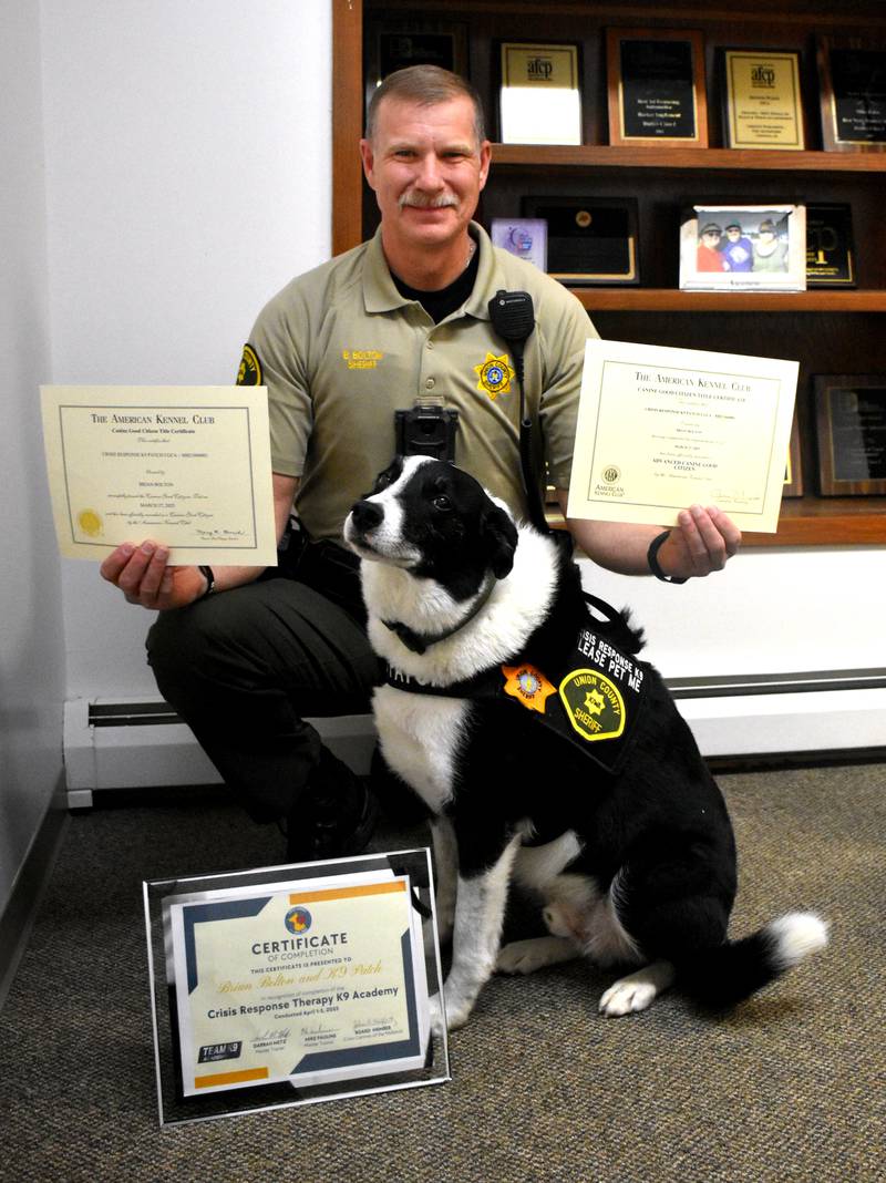Union County Sheriff Brian Bolton with his newly certified Crisis Canine Patch.