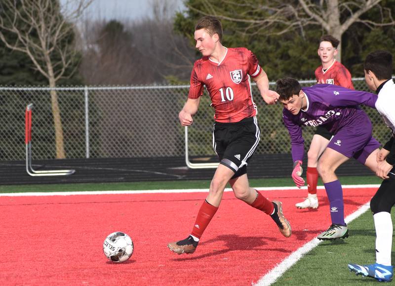 Creston senior Dillon Starlin launches a ball into the goal in the first half. He scored three on the night.