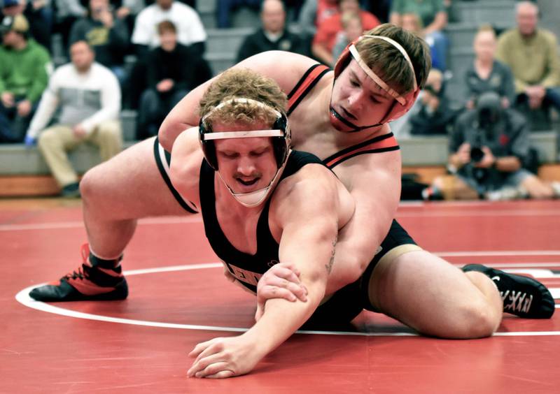 Heavyweight No. 12 Max Chapman works an arm bar on No. 8 Trent Patton of Glenwood. Chapman pinned Patton in the first period.