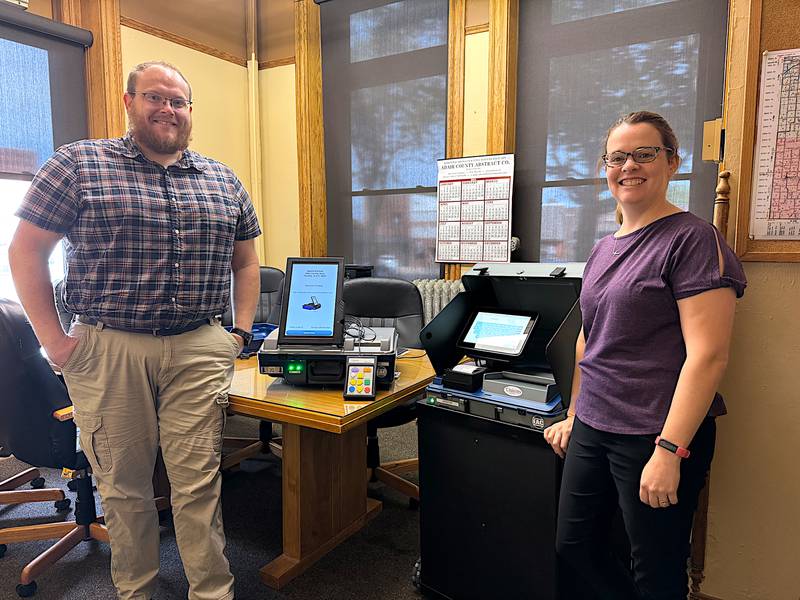 Adair County Elections Deputy Auditor Nathan Reed and County Auditor Mandy Berg showcase new elections equipment.