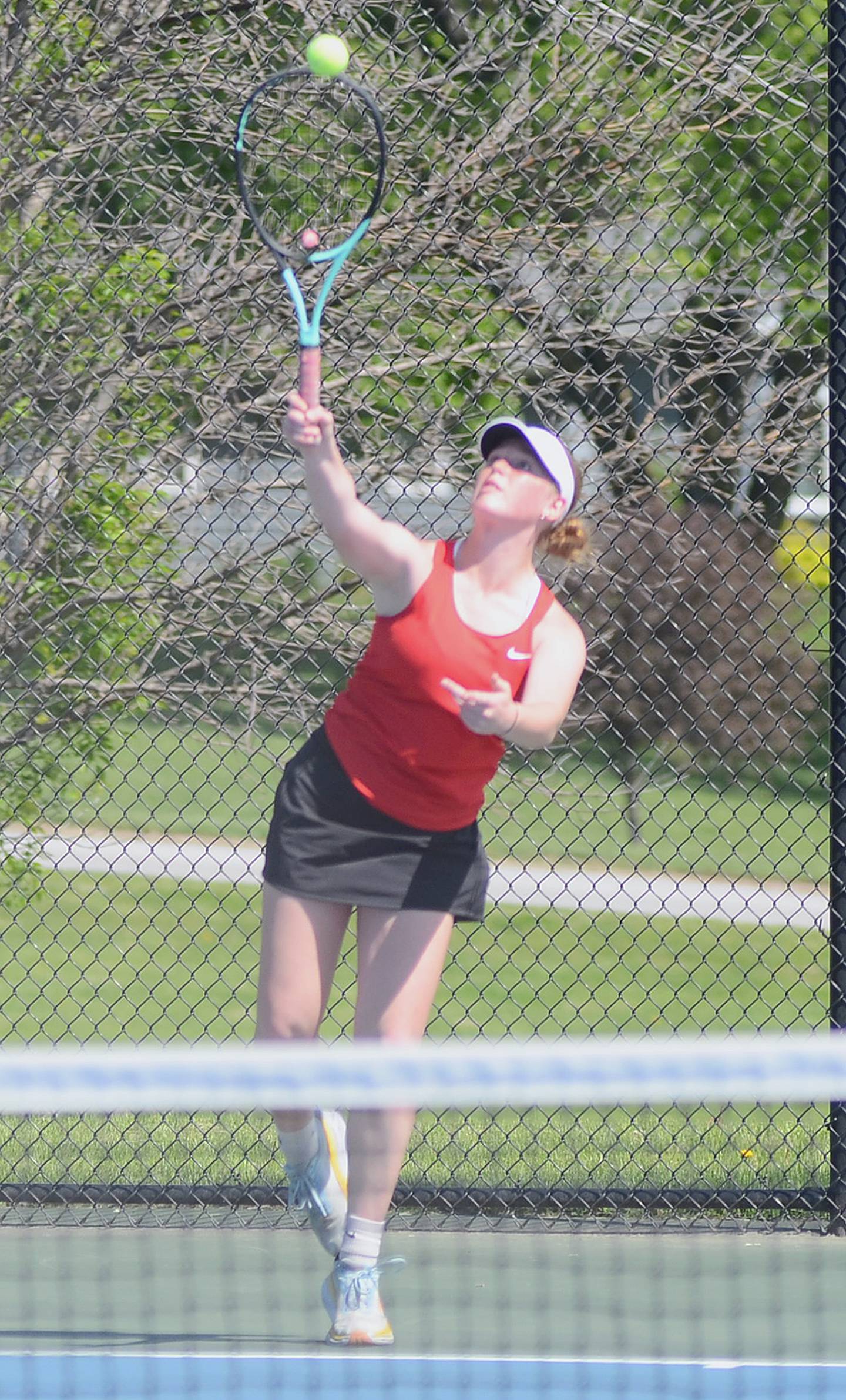 Violet Marcus of Creston serves against Atlantic during Friday's regional dual.