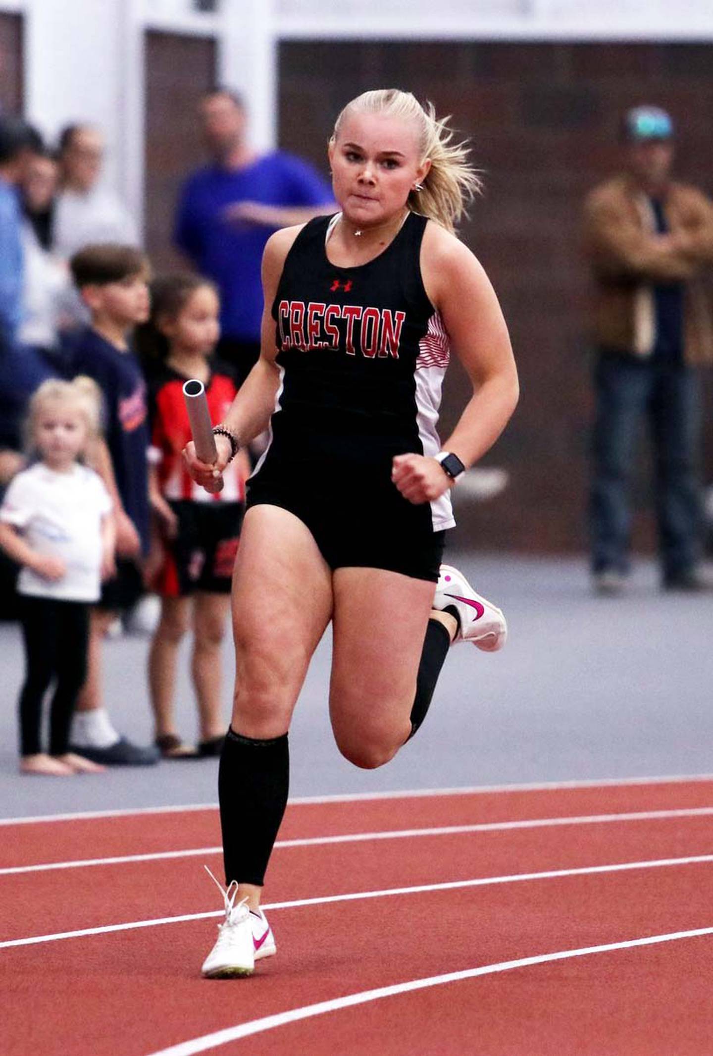 Maylee Riley of Creston runs a relay leg Saturday. Riley was a part of the sprint medley team that took 11th place with a time of 4:51.84.