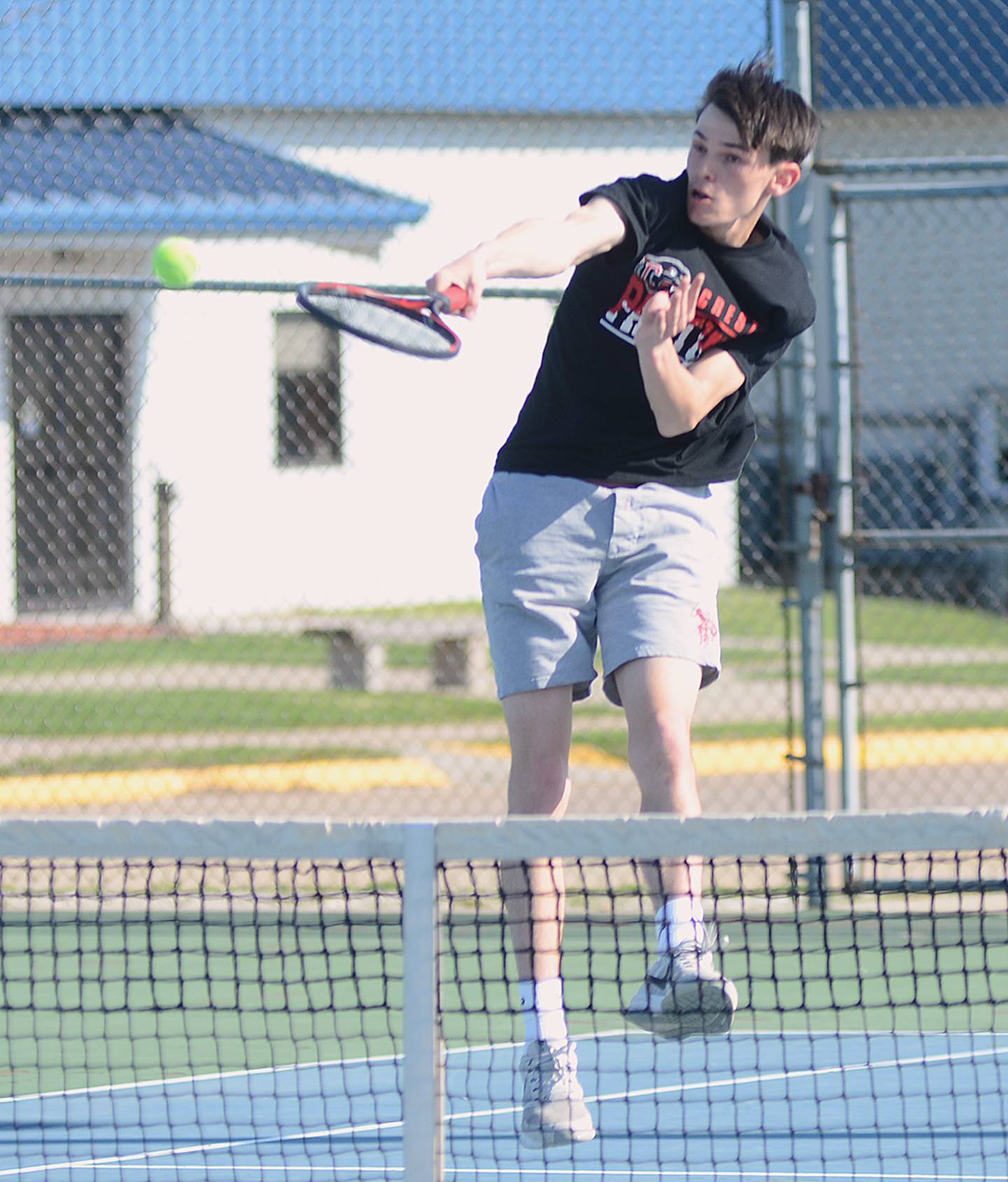 Creston No. 1 singles player Gavin Millslagle finishes a point in his 8-5 singles win Monday against Chariton.