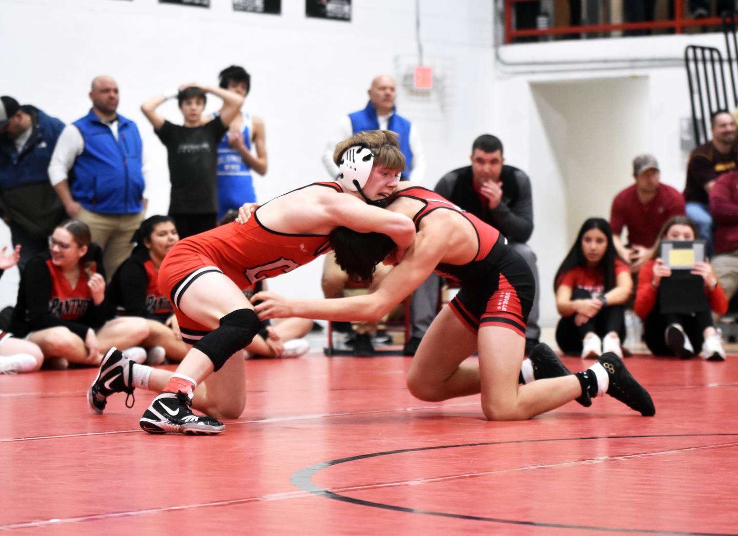 Brodrick Phelps fights for control with Anthony Knott of Centerville in the 138-pound semifinals. Phelps won the bout before taking second place to advance to state.