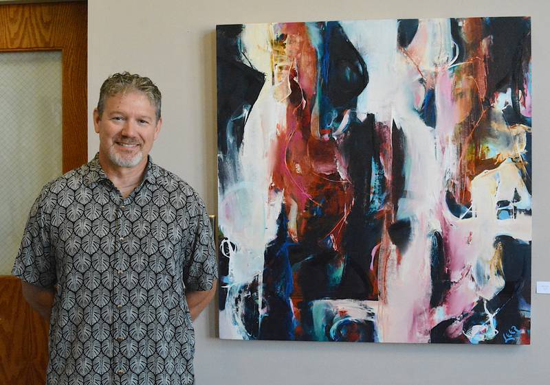 Patrick Leer next to his artwork. Leer's exhibit "Percussive Maintenance" is open at the Creston Arts Gallery.