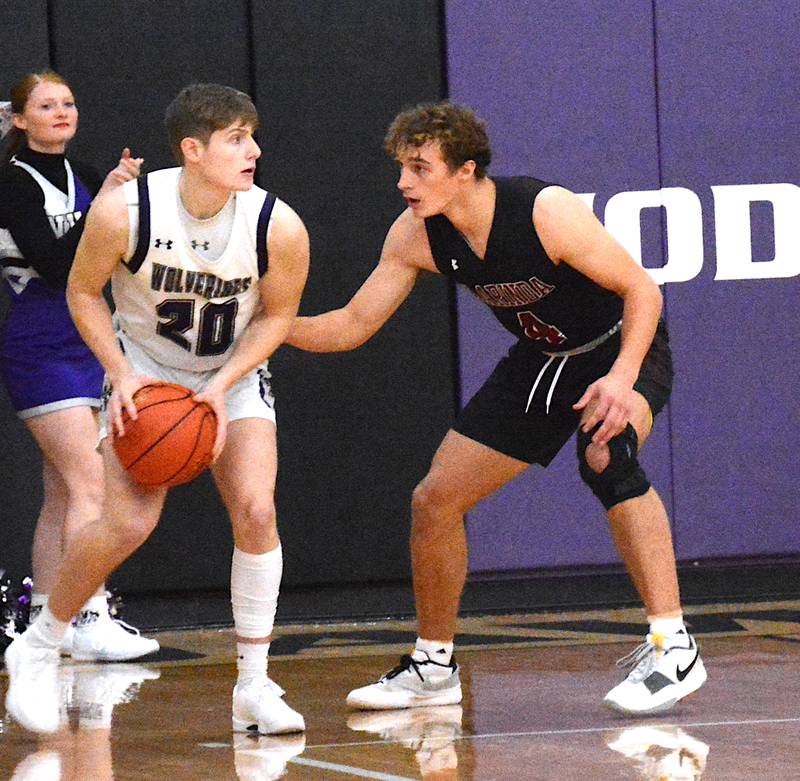 Clarinda's Cole Baumgart (4) guards Nodaway Valley/O-M's Dawson Nelson (20) in a game Monday, Nov. 29 at Nodaway Valley High School.