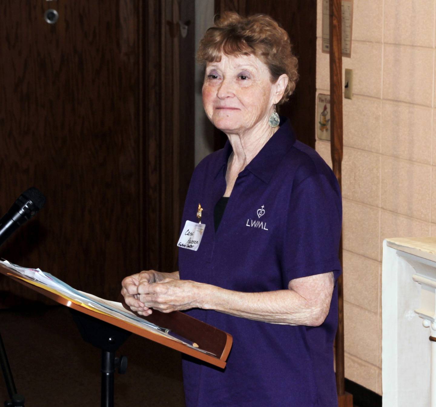 Zone President Carol Hansen leads the business meeting during a women's rally at Immanuel Lutheran Church in Greenfield.