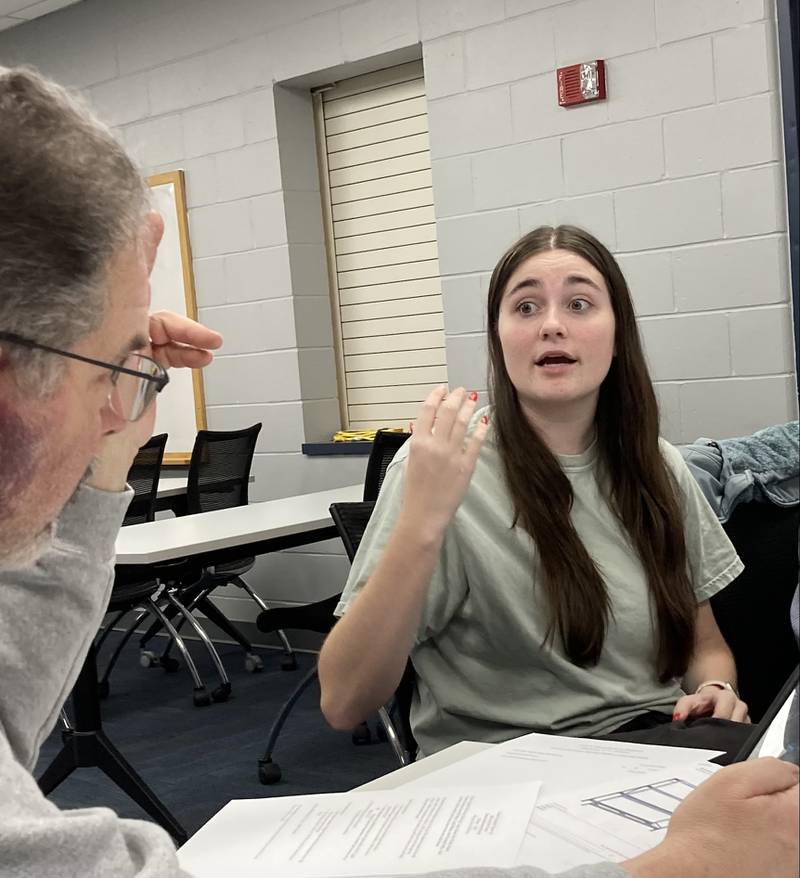 Bridget Hopkins discusses the show she's directing with the Crest Area Theatre board during a March meeting.